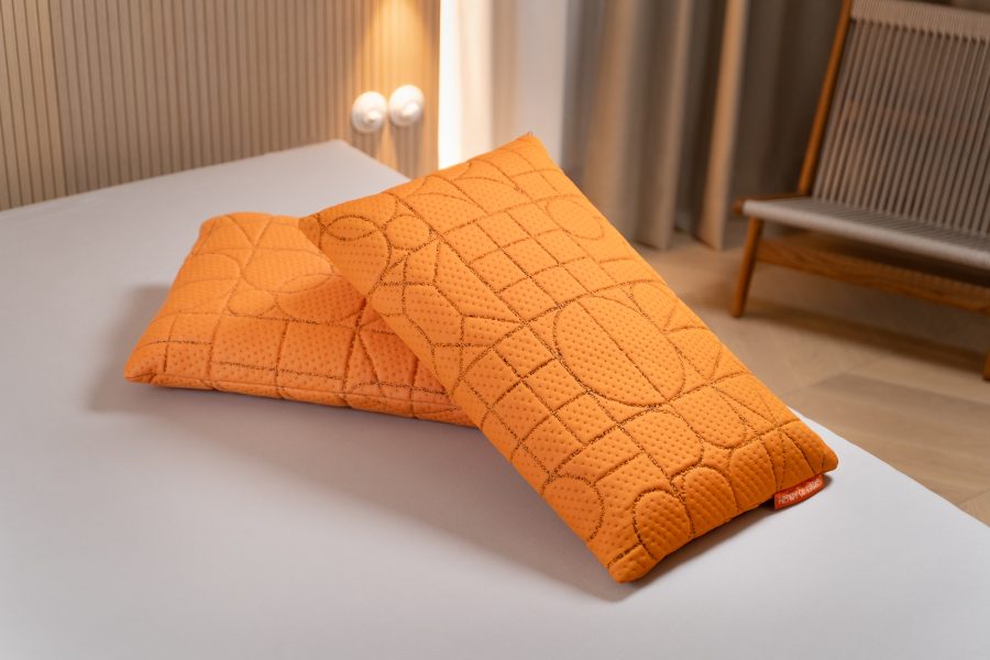 Étreinte Nocturne orange pillow Henry of Paris